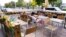 FILE - A person sits at an outdoor table in Montreal, Sept. 28, 2020. 