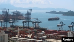 FILE - A cargo ship carrying containers is seen near the Yantian port in Shenzhen, Guangdong province, China May 17, 2020.