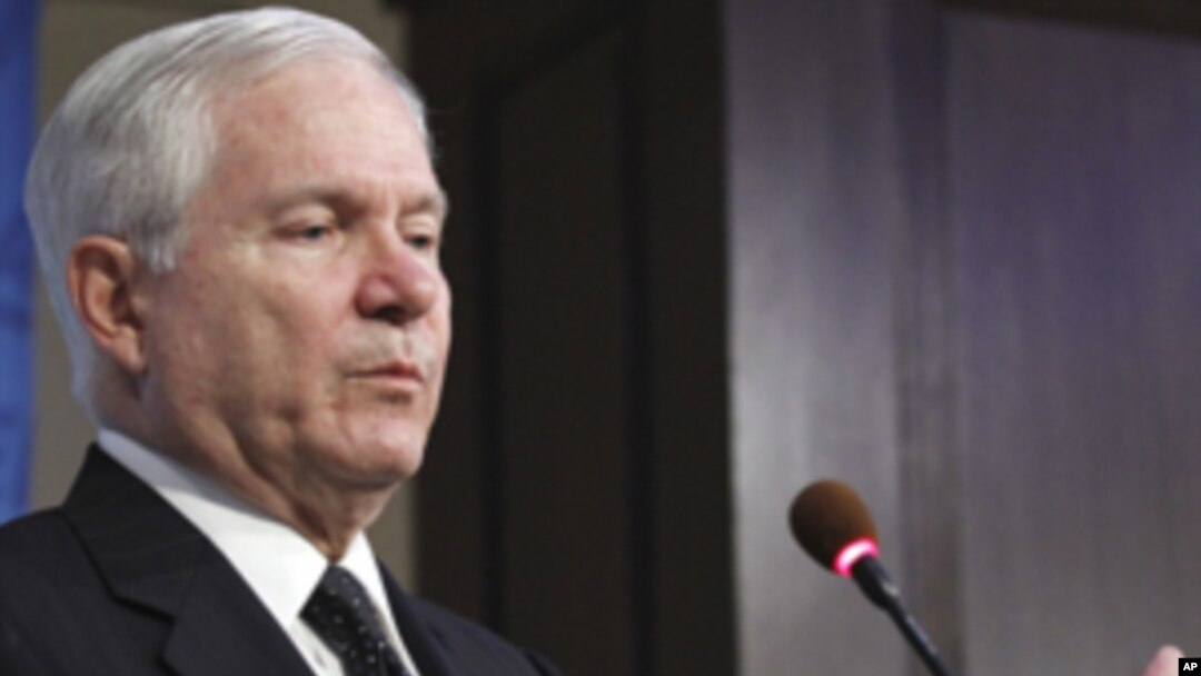 Defense Secretary Robert Gates gestures while speaking at the American Enterprise Institute for Public Policy Research in Washington, Tuesday, May 24, 2011