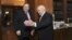 Greece's President Karolos Papoulias (right) welcomes Socialist leader Evangelos Venizelos for talks at his office May, 12 2012.