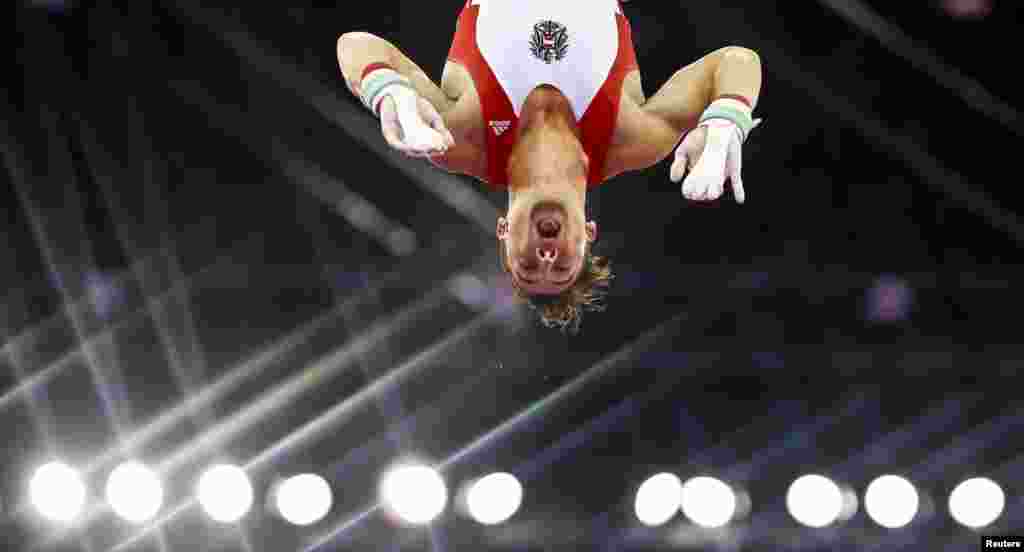 Fabian Leimlehner of Austria competes on the horizontal bar during the men&#39;s gymnastics team event at the 1st European Games in Baku, Azerbaijan.