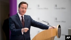 Britain's Prime Minister David Cameron answers a question from a journalist after delivering a speech on immigration at the Home Office in London, May 21, 2015. 