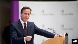 FILE - Britain's Prime Minister David Cameron answers a question from a journalist after delivering a speech on immigration at the Home Office in London, May 21, 2015. 