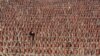 People participate in a ceremony at the Nanjing Massacre Memorial Hall on the second annual national day of remembrance to commemorate the 80th anniversary of the massacre in Nanjing, China.