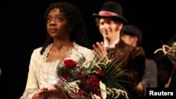 Emilie Kouatchou who performs as Christine Daae takes a final bow as confetti is released after the final performance of the Phantom of the Opera, which closes after 35 years on Broadway, in New York, April 16, 2023.