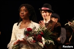 Emilie Kouatchou who performs as Christine Daae takes a final bow as confetti is released after the final performance of the Phantom of the Opera, which closes after 35 years on Broadway, in New York City, U.S., April 16, 2023. (REUTERS/Caitlin Ochs)