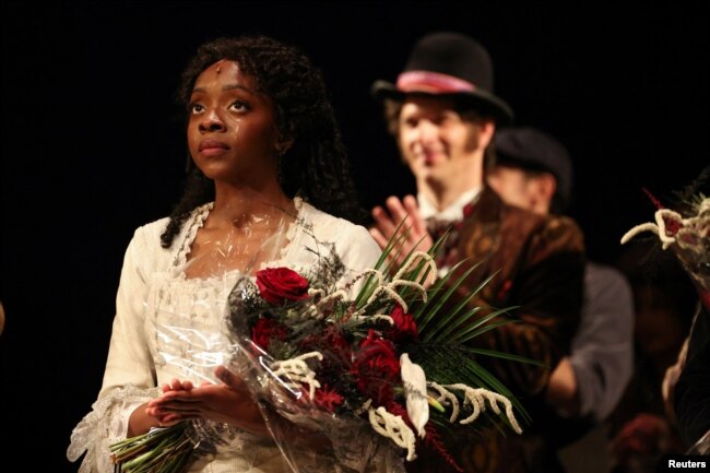 Emilie Kouatchou who performs as Christine Daae takes a final bow as confetti is released after the final performance of the Phantom of the Opera, which closes after 35 years on Broadway, in New York City, U.S., April 16, 2023. (REUTERS/Caitlin Ochs)