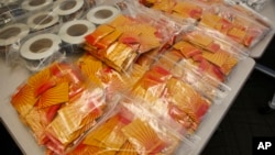 FILE - Confiscated synthetic drugs are seen on display.