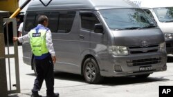 An unidentified van believed to be carrying the body of Kim Jong Nam comes out from the forensic department at Kuala Lumpur Hospital in Kuala Lumpur, Malaysia, March 30, 2017.