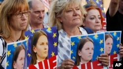 People rally in support of Lyudmyla Kozlovska, a Ukrainian activist banned from the entire Schengen zone due to a Polish request, in Warsaw, Poland, on Aug. 23, 2018.