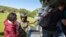 In this image provided by the Royal New Zealand Defense Force, tourists are evacuated by helicopter from Kaikoura following Monday's earthquake, in New Zealand, Nov. 15, 2016.