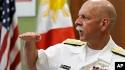 U.S. Pacific Fleet Commander Adm. Scott Swift gestures during an interview with journalists July 17, 2015 in Manila, Philippines. 