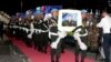 Cambodian military police officers carry coffins of Cambodian soldiers killed in Africa during the returning ceremony at Phnom Penh International Airport, in Phnom Penh, Cambodia, Sunday, May 21, 2017. Tears were shed and the sounds of cries were heard from the families of four Cambodian soldiers who were killed by a Christian rebel group in the Central African Republic earlier this month as the bodies arrived home Sunday. (AP Photo/Heng Sinith)