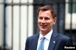 FILE - Britain's Foreign Secretary and Conservative Party leadership candidate Jeremy Hunt is seen outside Downing Street in London, Britain, July 22, 2019.