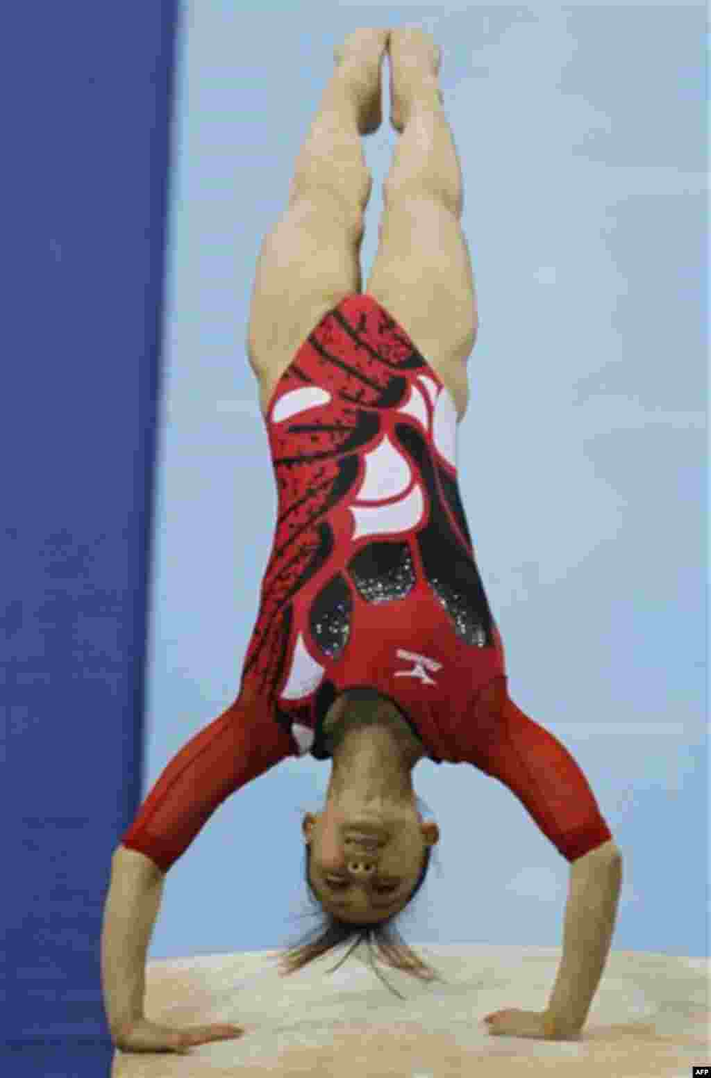 Japan's Rie Tanaka performs in the women's vault during the gymnastics at the 16th Asian Games in Guangzhou, China, Tuesday, Nov. 16, 2010. (AP Photo/Ng Han Guan)