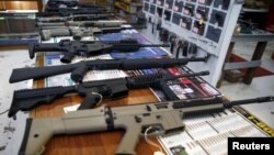 FILE - Guns for sale are displayed at Roseburg Gun Shop in Roseburg, Oregon, Oct. 3, 2015.