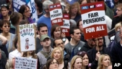 Union members are seen during a mass group gathering in Newcastle, England, June 30, 2011,as thousands of public service workers and teachers in Britain go on strike over pension and government cuts