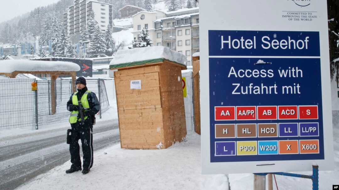 A police officer guards a checkpoint at the Seehof hotel during the World Economic Forum in Davos, Switzerland, Jan. 20, 2016. 