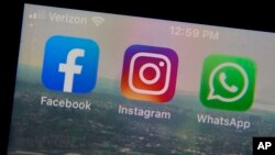 This photo shows the mobile phone app logos for, from left, Facebook, Instagram and WhatsApp in New York, Tuesday, Oct. 5, 2021. (AP Photo/Richard Drew)