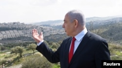 Israeli Prime Minister Benjamin Netanyahu delivers a statement overlooking the Israeli settlement of Har Homa, in the Israeli-occupied West Bank, that Israel annexed to Jerusalem after the region's capture in the 1967 Middle East war, Feb. 20, 2020.