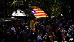 Pro-independence demonstrators gather during a protest against Spain's prime minister Pedro Sanchez outside the Gran Teatre del Liceu in Barcelona, Spain, Monday, June 21, 2021. Sanchez's said Monday that the Spanish Cabinet will approve pardons for…