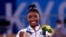Bronze medalist Simone Biles of the United States celebrates on the podium, Aug.. 3, 20221. 