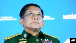 Commander-in-Chief of Myanmar's armed forces, Senior General Min Aung Hlaing delivers his speech at the IX Moscow conference on international security in Moscow, Russia, Wednesday, June 23, 2021. (AP Photo/Alexander Zemlianichenko, Pool)