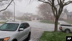 In this photo provided by Michael James, snow falls on a neighborhood in Niagara Falls, Ontario, Canada. Mother's Day weekend got off to an unseasonably snowy start in areas of the northeast thanks to the polar vortex. (Michael James via AP)