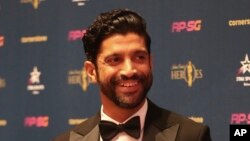 Aktor terkemuka India Farhan Akhtar saat menghadiri acara Cricket World Cup di London, 23 Mei 2019. (AP Photo/Aijaz Rahi)
