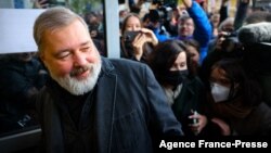 Russia's top independent newspaper Novaya Gazeta chief editor and the 2021 Nobel Peace Prize winner Dmitry Muratov meets with reporters outside the newspaper's office in Moscow on Oct. 8, 2021. 