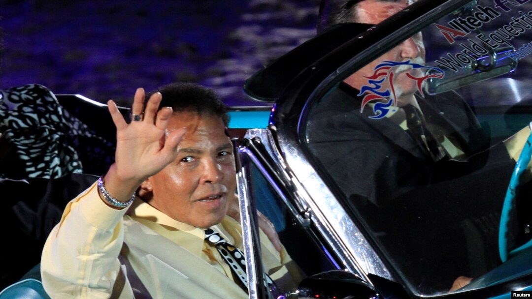 Boxing great Muhammad Ali waves to the crowd during the opening ceremony of the World Equestrian Games in Lexington, Kentucky, in this September 25, 2010 file photo.