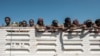 Members of the Amhara special forces look out from the back of a parked truck in Dansha, in the Tigray region of Ethiopia, Nov. 25, 2020.