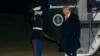 FILE - President Donald Trump greets a Marine Corps honor guard as he disembarks Marine One upon arrival on the South Lawn of the White House in Washington, Jan. 27, 2025.