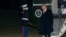 FILE - President Donald Trump greets a Marine Corps honor guard as he disembarks Marine One upon arrival on the South Lawn of the White House in Washington, Jan. 27, 2025.