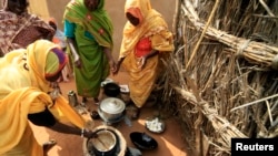 Women cook on a stove made out of mud at a women development program center funded by the WFP in North Darfur. (File)