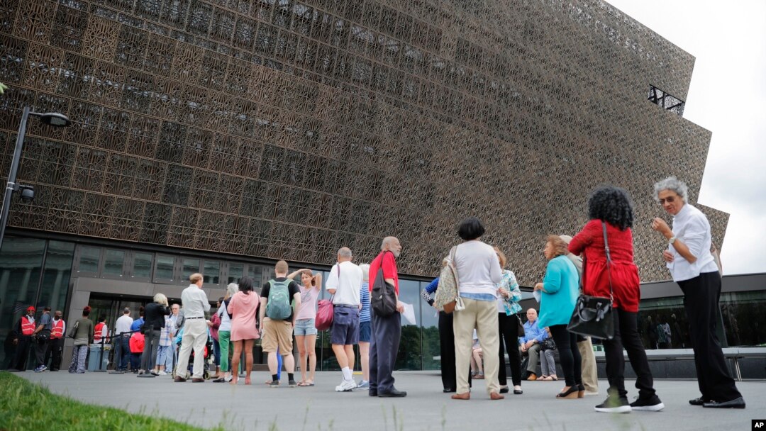FILE - People wait in line to enter the Smithsonian National Museum of African American History and Cultural on the National Mall in Washington, May 1, 2017. On Wednesday, a noose, a symbol of racism in the U.S., was found on Smithsonian grounds, the second such incident this week.