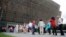 FILE - People wait in line to enter the Smithsonian National Museum of African American History and Cultural on the National Mall in Washington, May 1, 2017. On Wednesday, a noose, a symbol of racism in the U.S., was found on Smithsonian grounds, the second such incident this week.