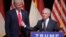 Republican U.S. presidential candidate Donald Trump listens as Senator Bob Corker speaks at a campaign rally in Raleigh, North Carolina, July 5, 2016. On Wednesday, Corker withdrew his name from consideration as Trump's possible pick for vice president. 