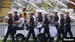 FILE: The casket of Brazilian football legend Pele is moved from the center circle of his former club Santos' Vila Belmiro stadium. Taken January 3, 2023 