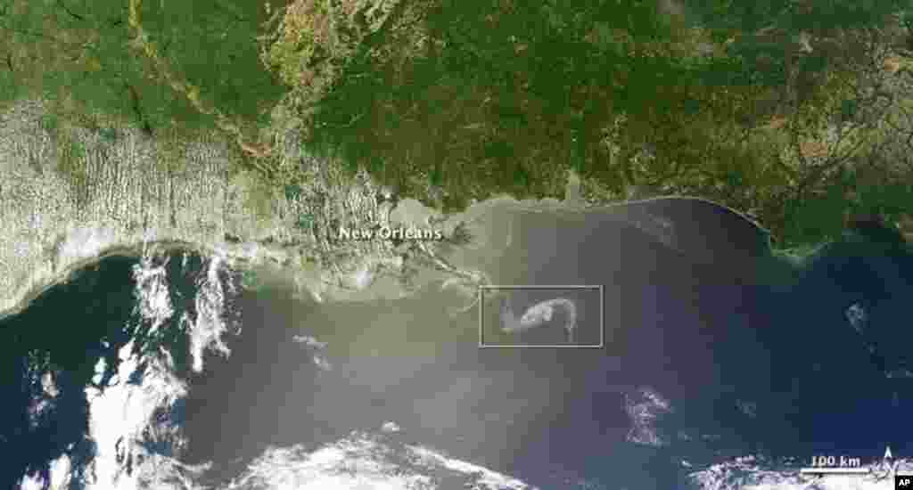 The MODIS image on the Terra satellite captured a wide-view natural-color image of the oil slick (outlined in white) just off the Louisiana coast, 29 Apr 2010. (NASA Image)