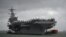 The USS George H.W. Bush aircraft carrier is seen anchored off Stokes Bay in the Solent, Britain, July 27, 2017. 