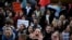 People shout slogans during a march organized by the Fridays for Future international movement of school students outside of the COP25 climate talks congress in Madrid, Spain, Dec. 13, 2019.