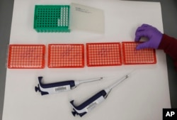 FILE - Tools used for DNA testing are pictured in a lab at the Oklahoma State Bureau of Investigation in Edmond, Oklahoma on August 1, 2014. (AP Photo/Sue Ogrocki/File)