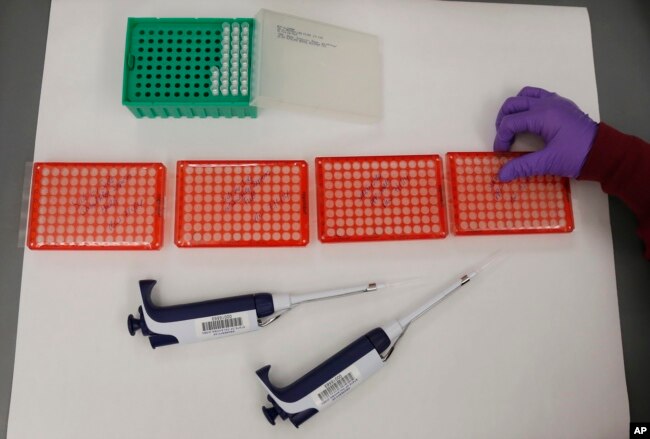 FILE - Tools used for DNA testing are pictured in a lab at the Oklahoma State Bureau of Investigation in Edmond, Oklahoma on August 1, 2014. (AP Photo/Sue Ogrocki/File)