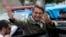 FILE - Jair Bolsonaro waves after voting in the presidential runoff election in Rio de Janeiro, Brazil, Oct. 28, 2018. 