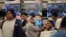 Shoppers stand in a checkout line during Black Friday sales at a Target store in Culver City, California, Nov. 25, 2016.