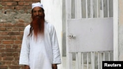 Sanaullah Haq is seen in his regular jail uniform after attending a routine practice inside Kotbhalwal central jail in Jammu in this May 20, 2011 file picture. Haq, a convicted Pakistani militant jailed in India, died on May 9, 2013 after being beaten by 