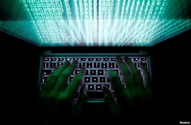 FILE - A man types on a computer keyboard in this illustration picture taken Feb. 28, 2013.