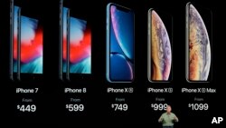 Phil Schiller, Apple's senior vice president of worldwide marketing, speaks about the new Apple iPhone XS, iPhone XS Max and the iPhone XR at the Steve Jobs Theater during an event to announce new Apple products, Sept. 12, 2018, in Cupertino, Calif. 