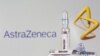 A test tube labeled with the vaccine is seen in front of AstraZeneca logo